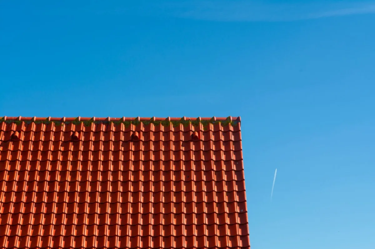 Tile roof gable in full sun, the kind of exposure that sets roof life in Utica, NY